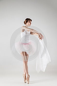 Ballet dancer in white tutu posing