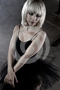 Ballet dancer, young in an industry area, sensual blonde wo