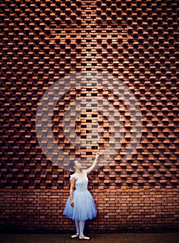 Ballet dancers, crosses, red brick walls