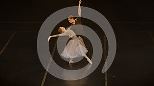 Ballet dancers practice lifts and spinning ballet movements