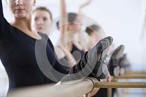 Ballet Dancers Practicing At The Barre