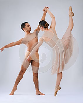 .Ballet dancing couple, studio and holding hands for balance, finesse and art movement for beauty in class. Young dancer