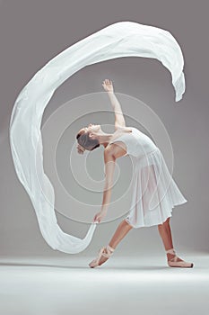 Ballet, fabric and woman in studio for dancing, balance and performance or art for fitness. Female dancer, contemporary