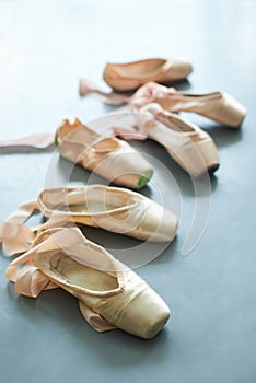 Ballet pointe shoes on the floor.