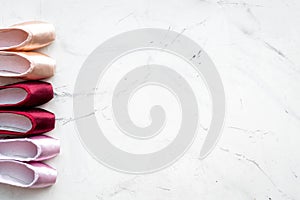 Ballet pointe shoes on white background top view copy space
