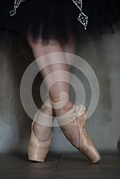 Ballet shoes by prima ballerina and her legs photo