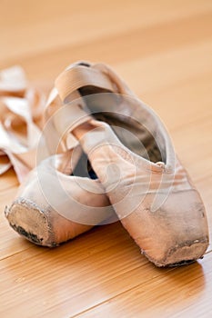 Ballet slippers in well-worn condition