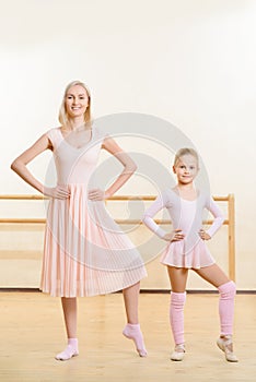 Ballet teacher and her apprentice are busy dancing photo