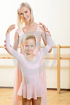 Ballet teacher and her apprentice during lesson