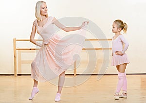 Ballet teacher and her little apprentice in the
