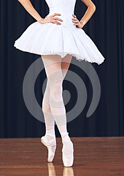 Ballet woman dancer on theatre stage for a dance performance or training for a professional art career. Artistic academy