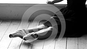 Ballet woman resting on the floor.