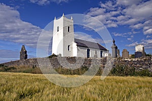 Ballintoy Church of Ireland above barley field, Antrim