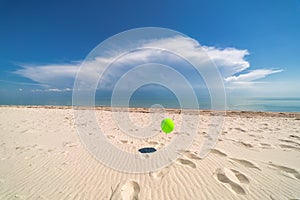 Balloon on background of ocean. Beach. Clouds