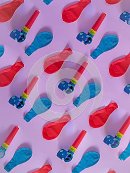 Balloon and blower party pattern on pink