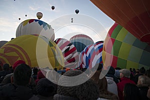 Balloon festival at dawn many aerostatics balloons rise them up