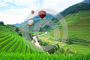 Balloon float in the rice fields on terraced of Mu Cang Chai, YenBai, Vietnam. photo