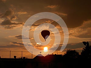 Balloon floating on evening sky with clouds