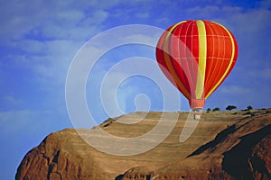 Balloon flying over Red Rock, New Mexico photo