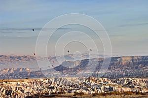 Balloon. Hilly landscape and balloons - Landmark attraction in Goreme, Cappadocia - Turkey