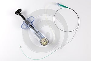 A balloon inflation device used in angioplasty procedure. Mesh metal balloon-expandable stent for endovascular surgery sinning on