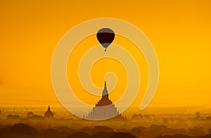 Balloon over plain of Bagan in misty morning, Myanmar