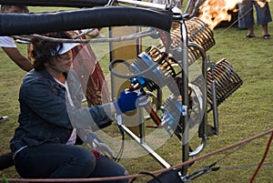 Balloonist operating burner