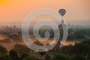 Balloons fly over thousand of temples in sunrise in Bagan, Myanmar