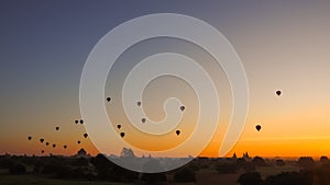 Balloons flying over Dhammayangyi Temple in Bagan Myanmar, Ballooning over Bagan is one of the most memorable action for tourists