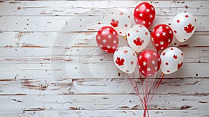 Balloons in the national colors of the Canadian flag on a light wooden background. Holiday card for birthday or holiday