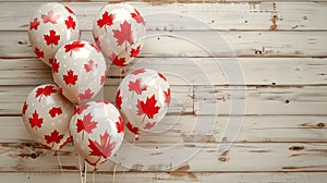 Balloons in the national colors of the Canadian flag on a light wooden background. Holiday card for birthday or holiday