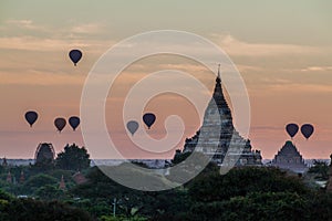 Balloons over Bagan and the skyline of its temples, Myanmar. Sulamani temple and Shwesandaw pagod