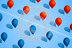 Balloons red and blue color. Symbol of division of society. Ð¡oncept of confrontation between races, religions, and States