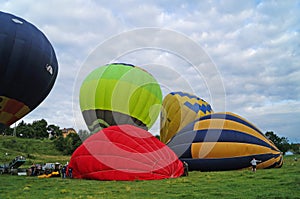 Balloons of blue and yellow color rises into the sky