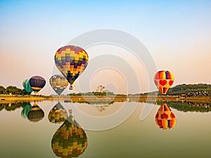 Balloons in the start of journey trip on sunset sky