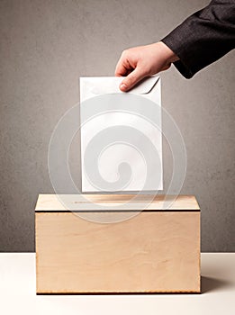 Ballot box with person casting vote