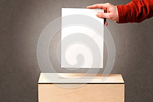 Ballot box with person casting vote
