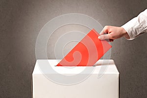 Ballot box with person casting vote