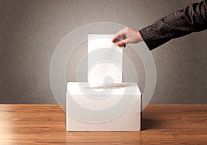 Ballot box with person casting vote