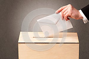 Ballot box with person casting vote