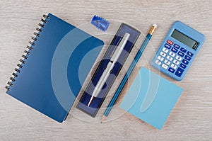 Ballpoint pen in box, pencil, notepad and calculator