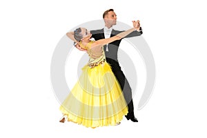 Ballrom dance couple in a dance pose isolated on black background