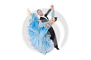 Ballrom dance couple in a dance pose isolated on black background