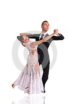 Ballrom dance couple in a dance pose isolated on white bachground