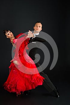 Ballrom dance couple in a dance pose isolated on white bachground