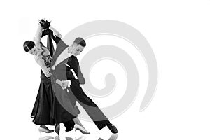 Ballroom dance couple in a dance pose isolated on white