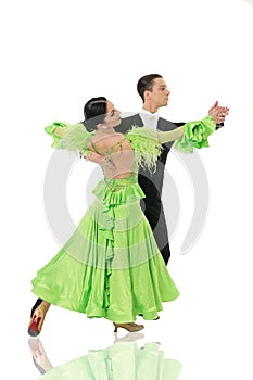 Ballroom dance couple in a dance pose isolated on white background. ballroom sensual proffessional dancers dancing walz