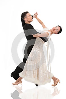 Ballroom dance couple in a dance pose isolated on white