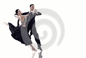 Ballroom dance couple in a dance pose isolated on white