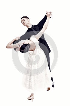 Ballroom dance couple in a dance pose on white